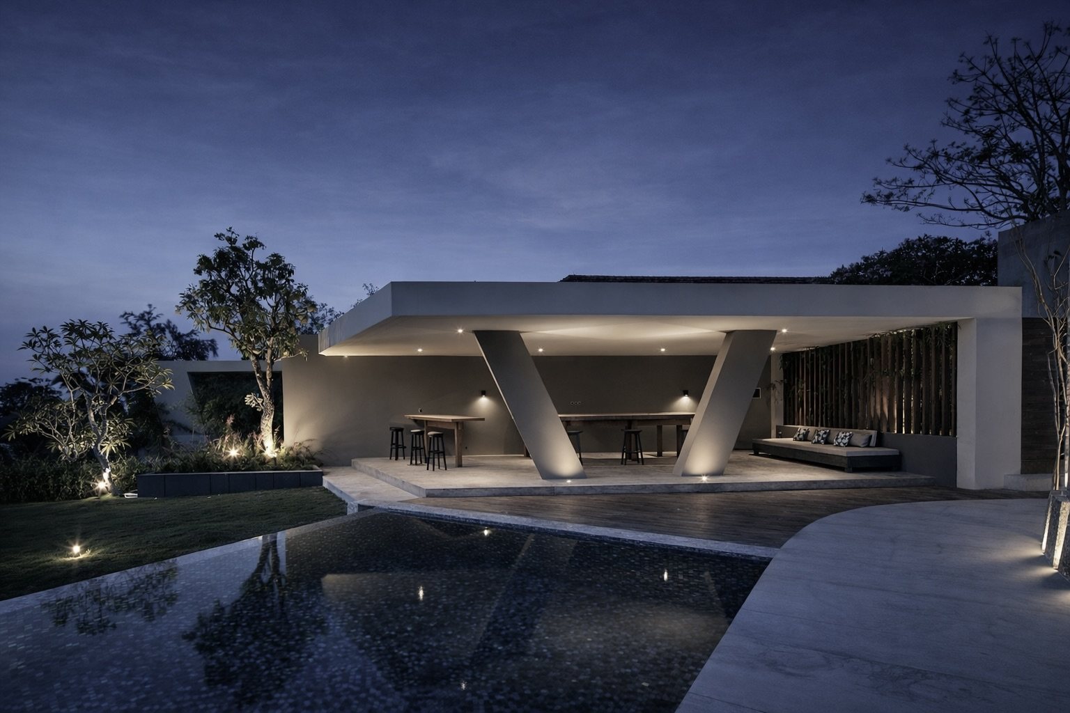 Twilight pavilion — angled columns under a cantilevered roof.